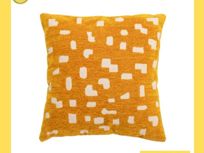 Cojin amarillo con puntos